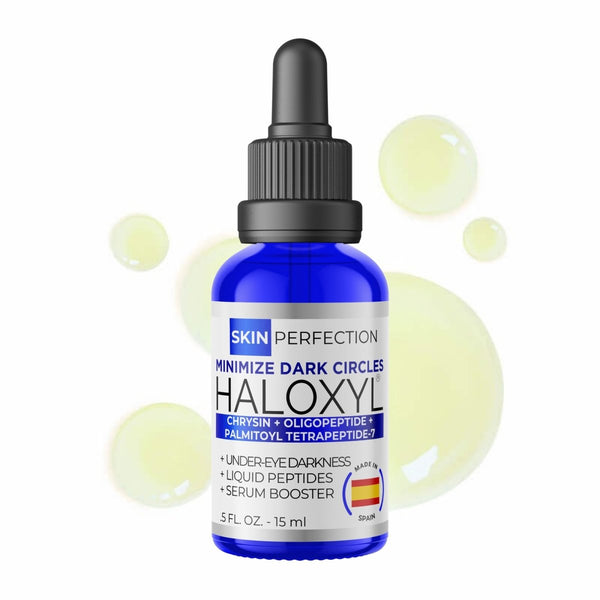 Bottle of Haloxyl serum with dropper on a white background with pale green droplets